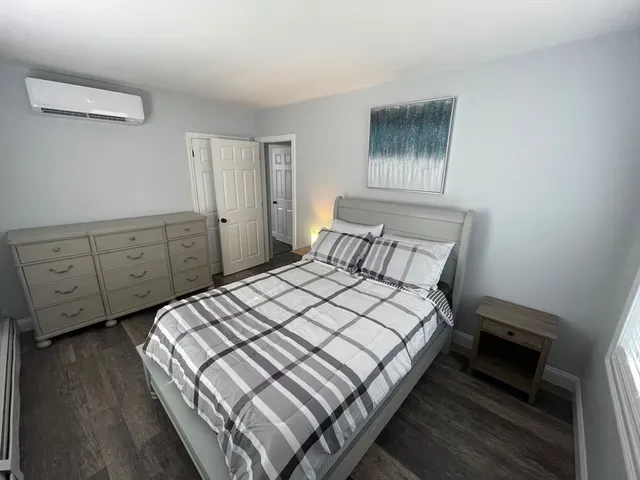 a bedroom with a bed and a cabinets
