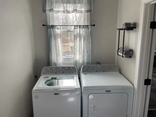a utility room with dryer and washer