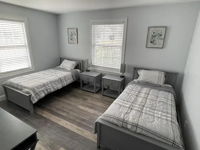 a bedroom with bed and a window