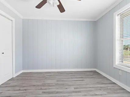 a reading room with furniture and a window