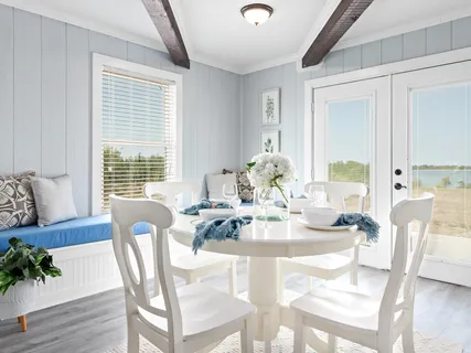 a living room with furniture and a chair