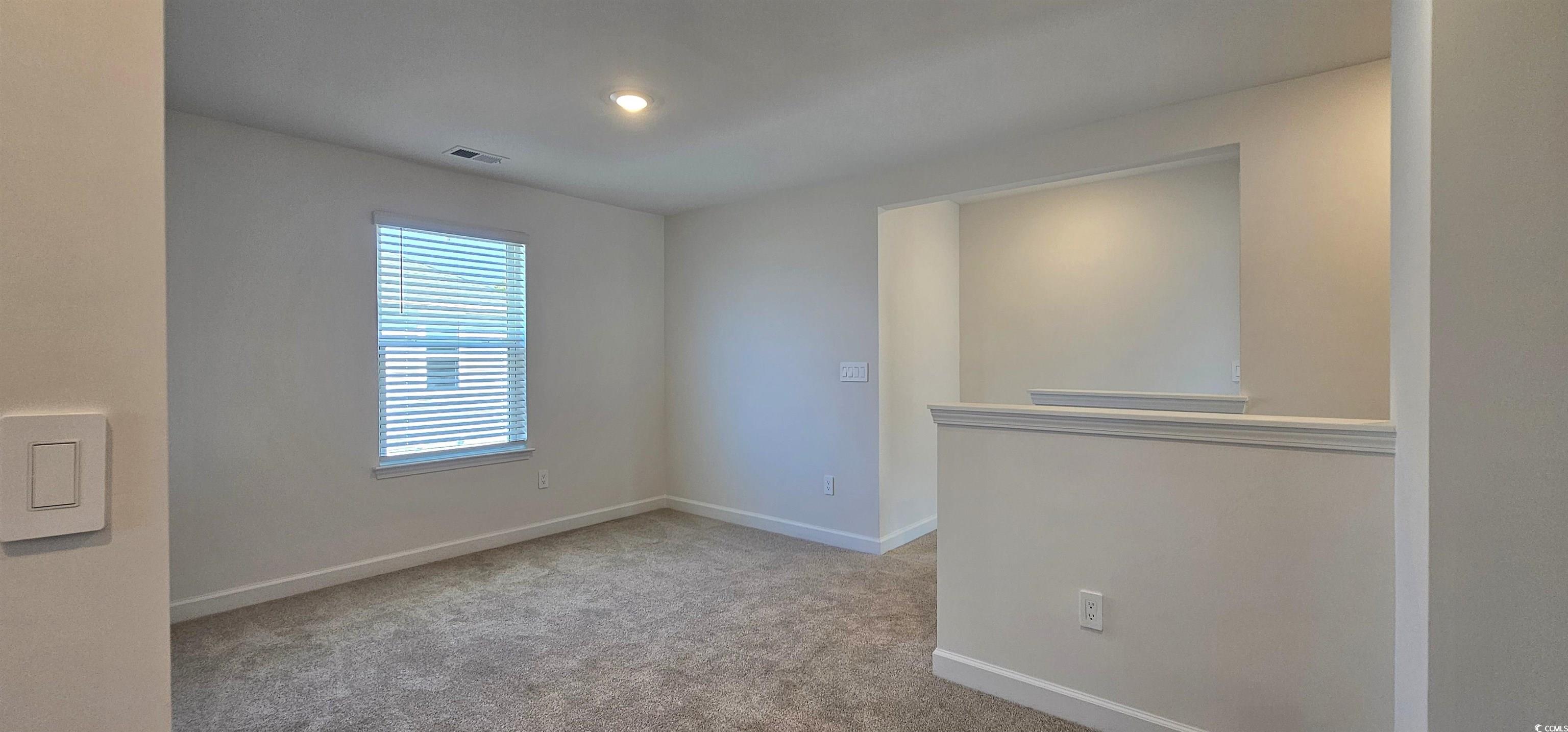 8233 Vibrant Loop Columbia, SC 29209 - Photo 17 of 40 Empty room featuring light carpet and baseboards