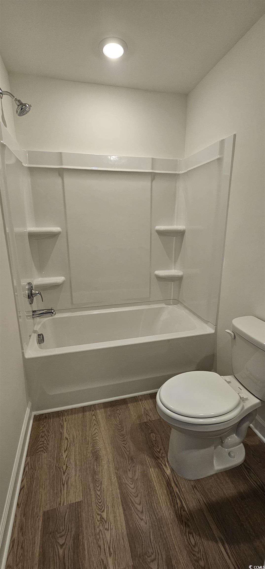8233 Vibrant Loop Columbia, SC 29209 - Photo 32 of 40 Bathroom with tub / shower combination and dark wood-type flooring