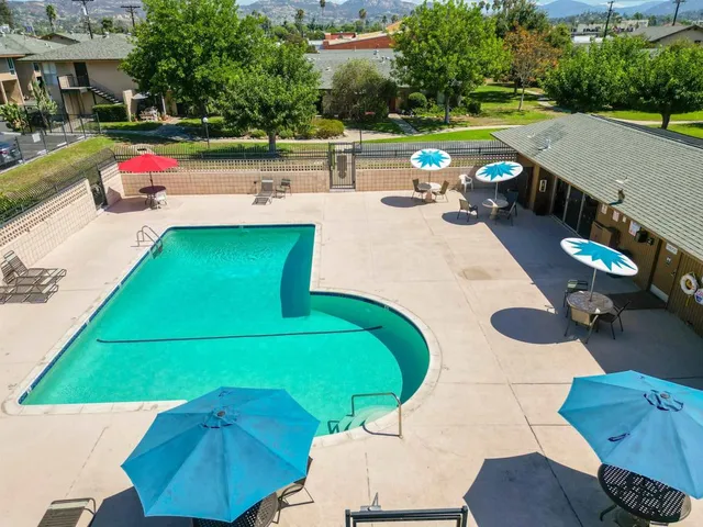 a view of a patio with swimming pool