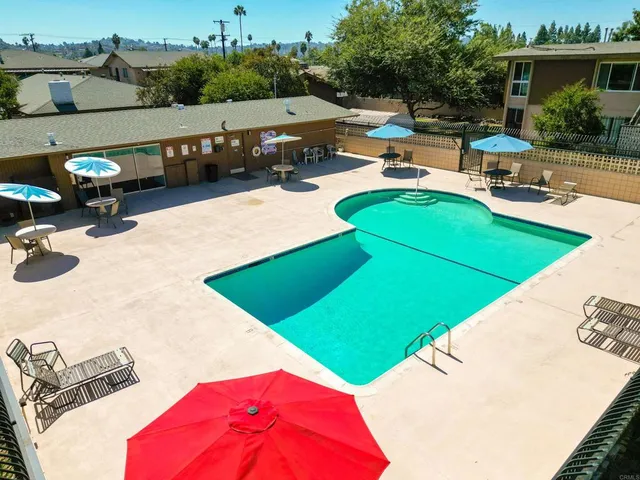 a view of a yard with potted plants