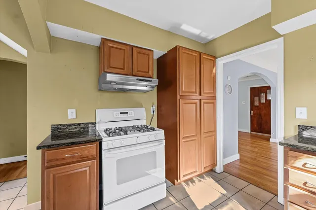 a kitchen with a stove microwave and refrigerator