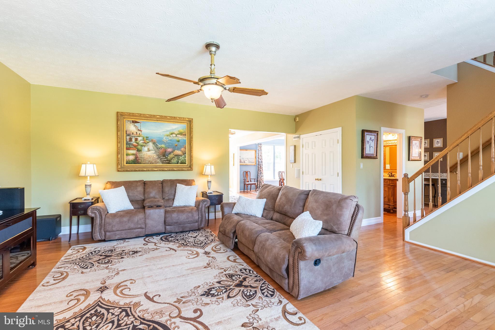 1907 Wagner Farm Road Bel Air, MD 21015 - Photo 11 of 67 a living room with furniture wooden floor and a flat screen tv