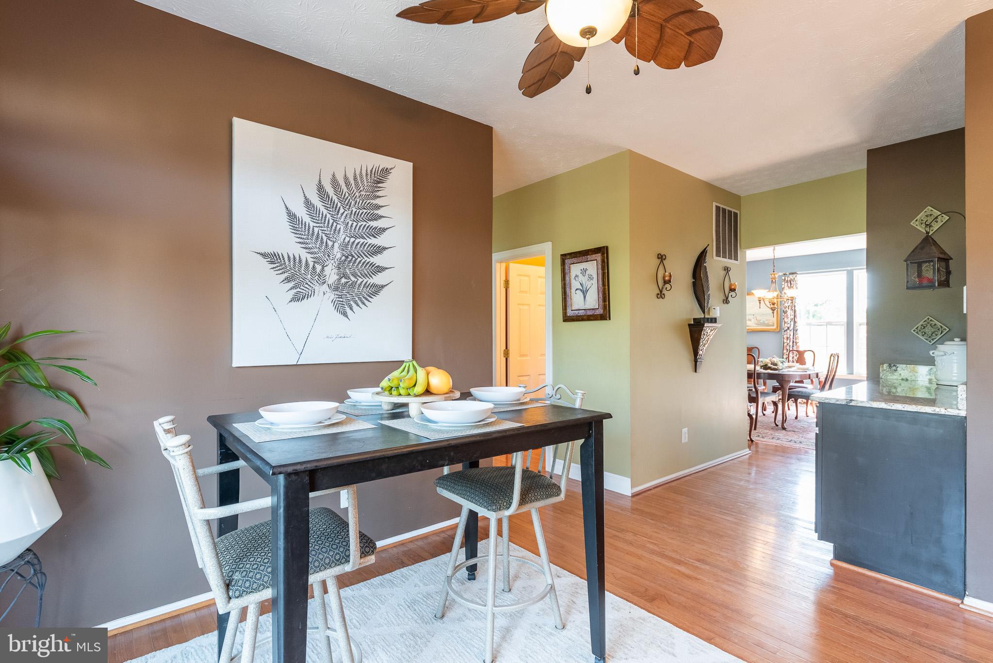 1907 Wagner Farm Road Bel Air, MD 21015 - Photo 18 of 67 a view of a dining room with furniture and wooden floor