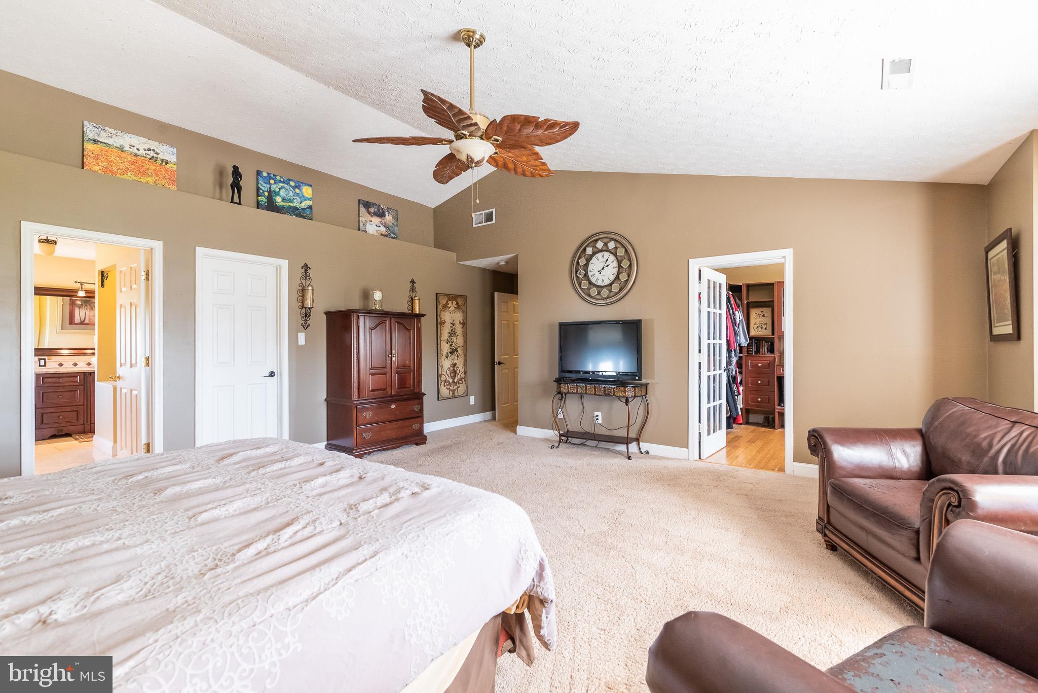 1907 Wagner Farm Road Bel Air, MD 21015 - Photo 25 of 67 a living room with furniture a clock and a fireplace