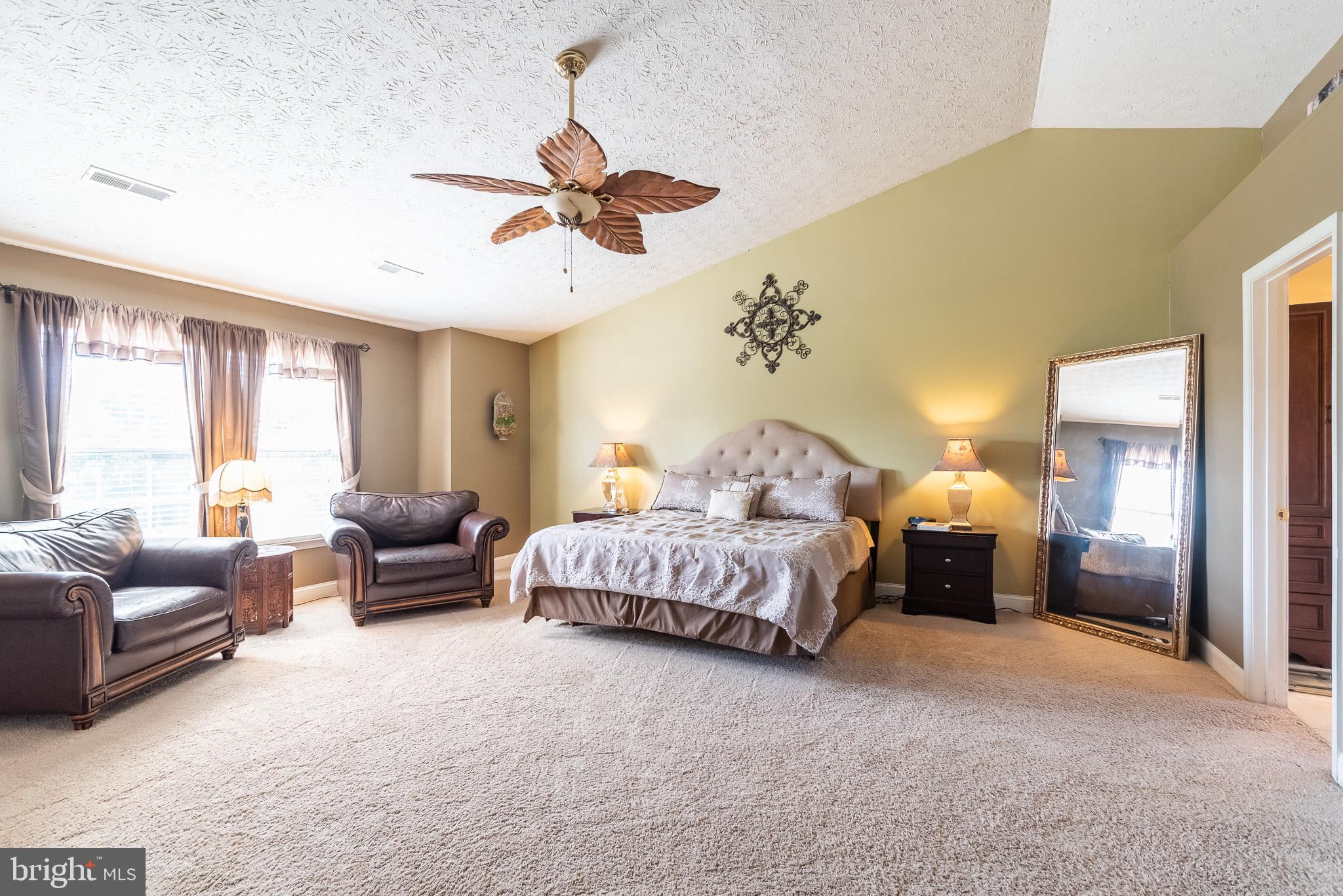 1907 Wagner Farm Road Bel Air, MD 21015 - Photo 26 of 67 a spacious bedroom with a bed couch and window