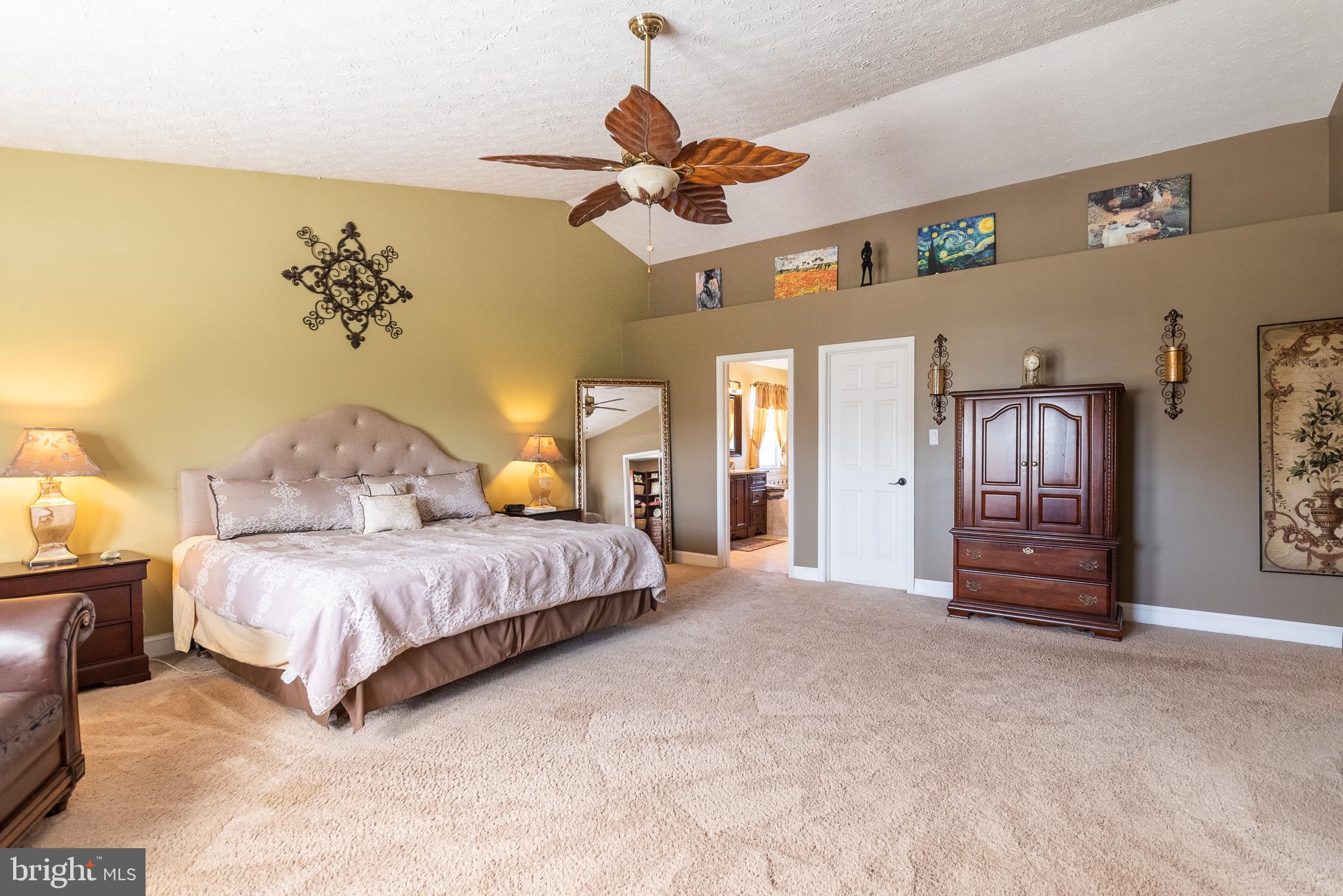 1907 Wagner Farm Road Bel Air, MD 21015 - Photo 27 of 67 a spacious bedroom with a bed and ceiling fan