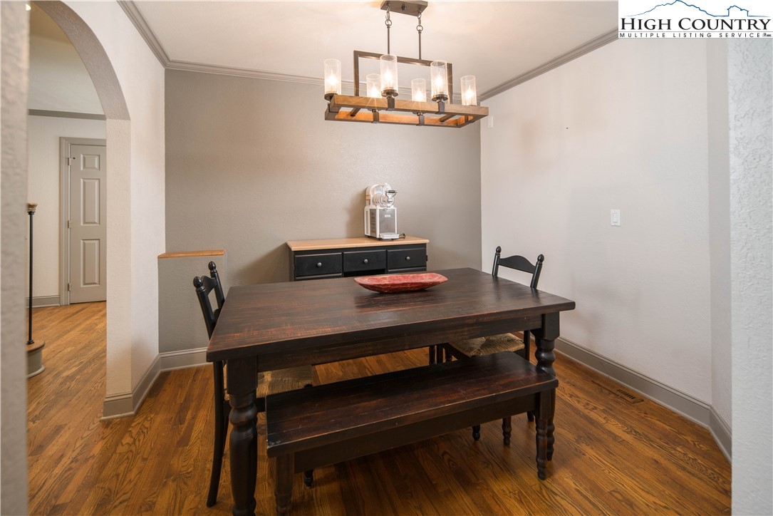 1527 Mabel School Road Zionville, NC 28698 - Photo 14 of 49 a view of a workspace with furniture and wooden floor