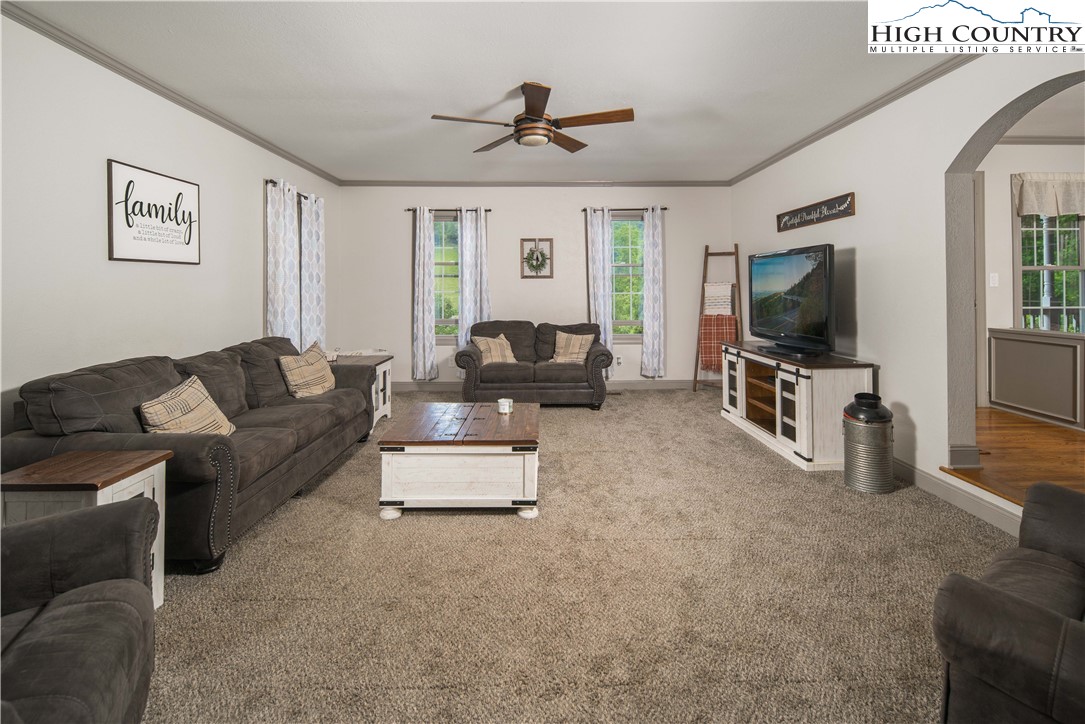 1527 Mabel School Road Zionville, NC 28698 - Photo 15 of 49 a living room with furniture and a flat screen tv