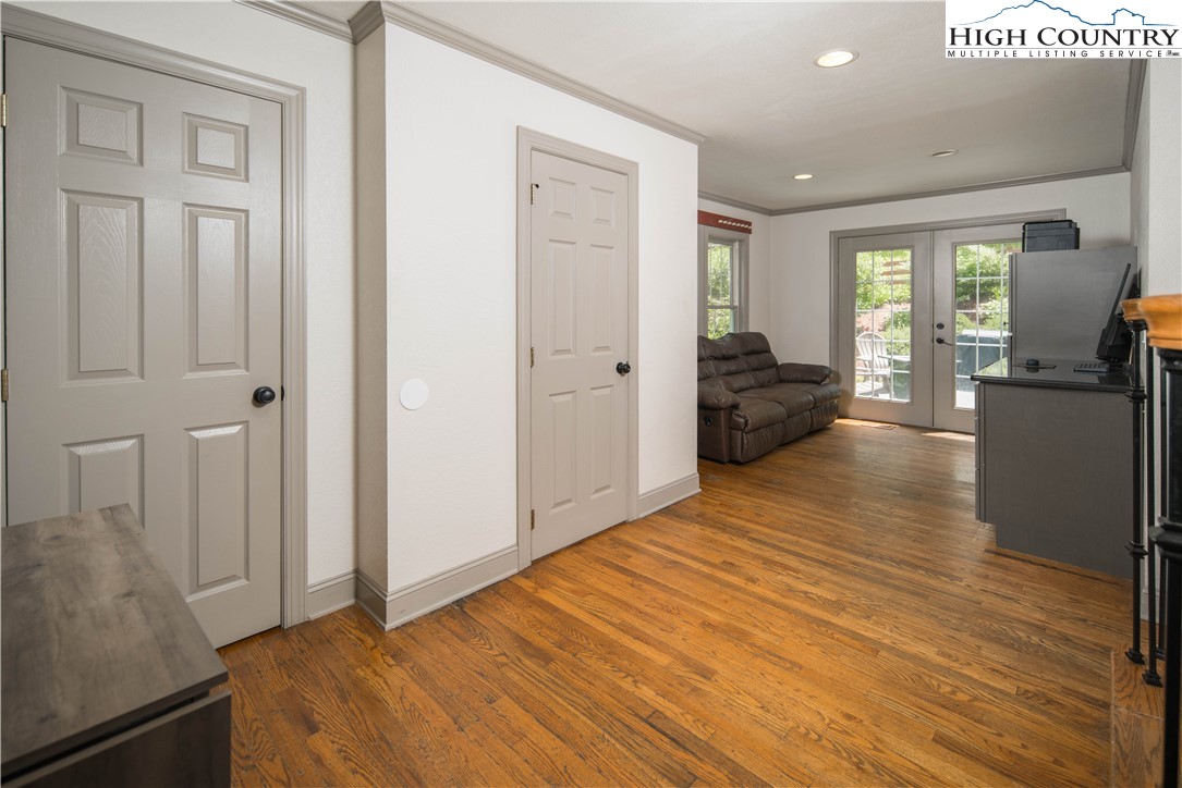 1527 Mabel School Road Zionville, NC 28698 - Photo 18 of 49 a bedroom with a bed and wooden floor