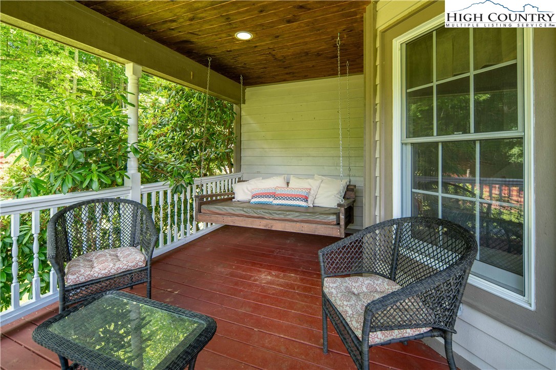1527 Mabel School Road Zionville, NC 28698 - Photo 21 of 49 a balcony with furniture and a yard