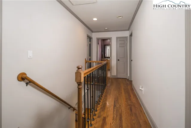 a bathroom with a double vanity sink a mirror and a shower
