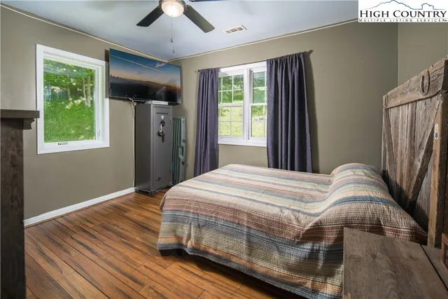 a bedroom with a large bed and a window