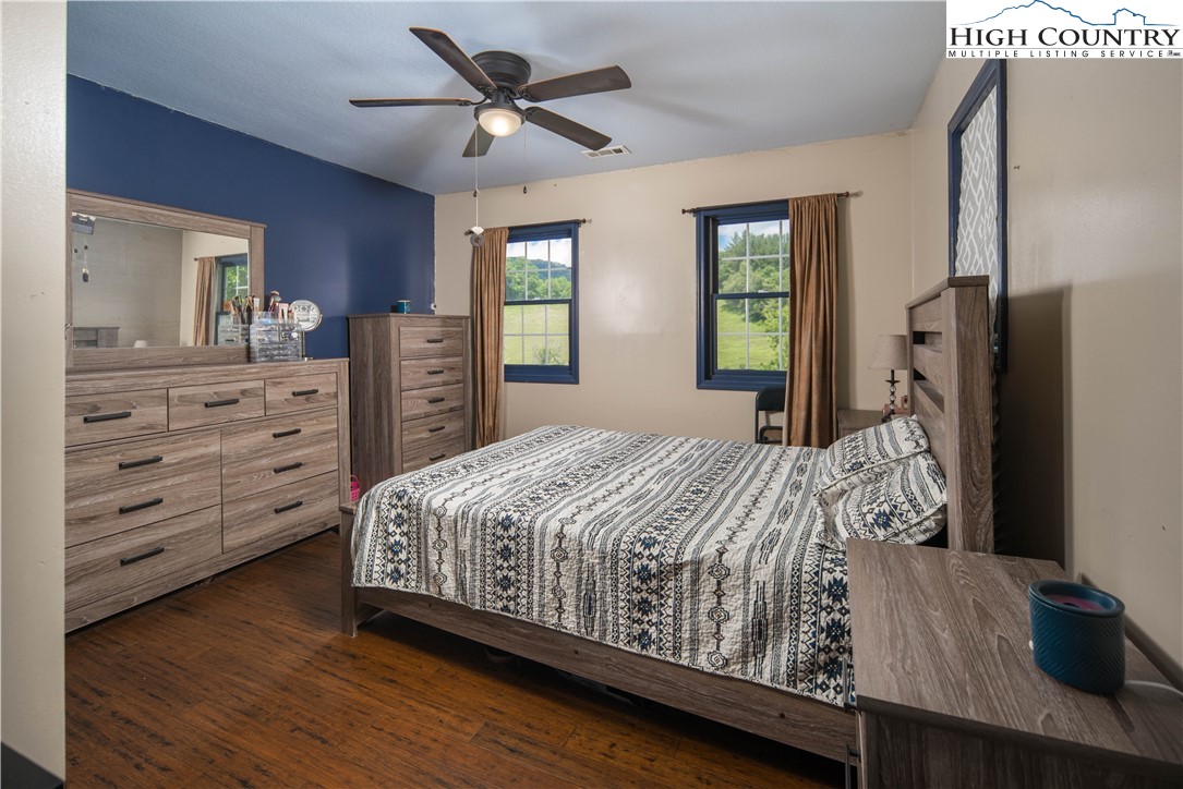 1527 Mabel School Road Zionville, NC 28698 - Photo 32 of 49 a bedroom with a large bed and a window