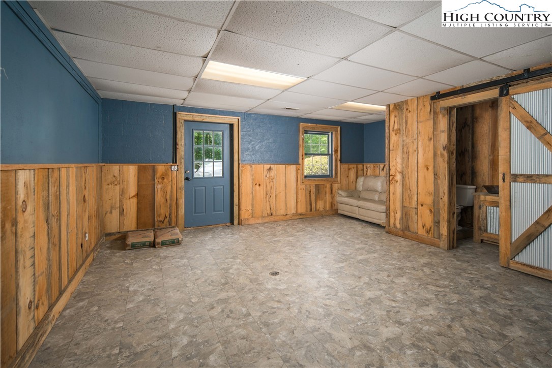 1527 Mabel School Road Zionville, NC 28698 - Photo 35 of 49 a view of an empty room with furniture and windows