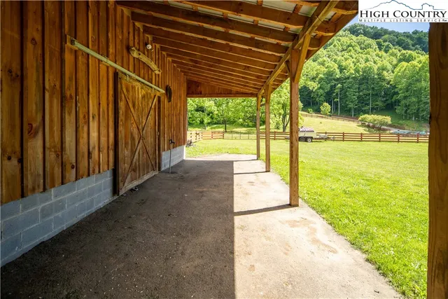 a view of an empty room with wooden walls