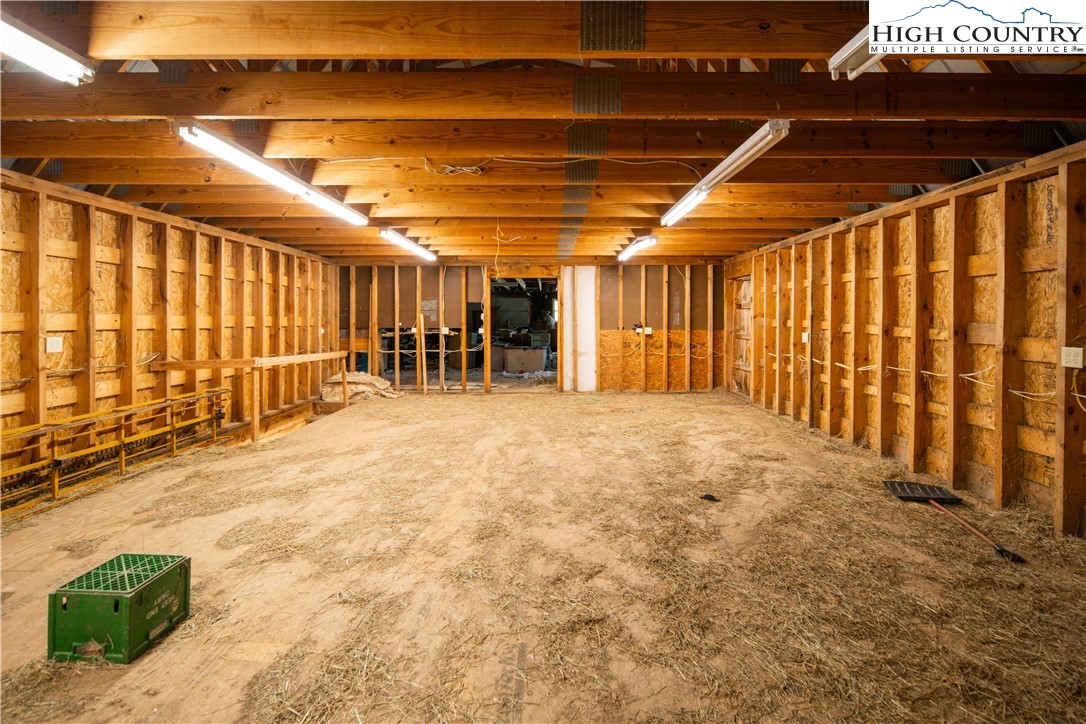 1527 Mabel School Road Zionville, NC 28698 - Photo 46 of 49 a view of an empty room with wooden walls