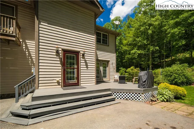 a kitchen with granite countertop stainless steel appliances a refrigerator and cabinets