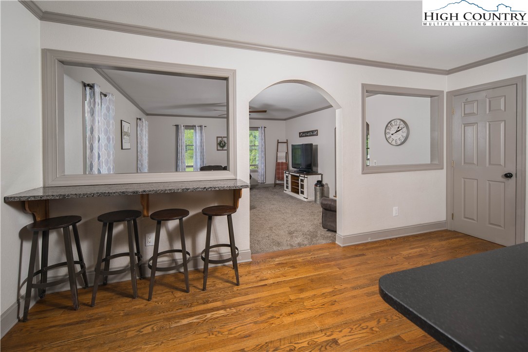 1527 Mabel School Road Zionville, NC 28698 - Photo 10 of 49 a view of a livingroom with furniture and hardwood floor
