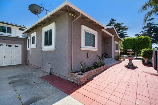 a front view of a house with entertaining space