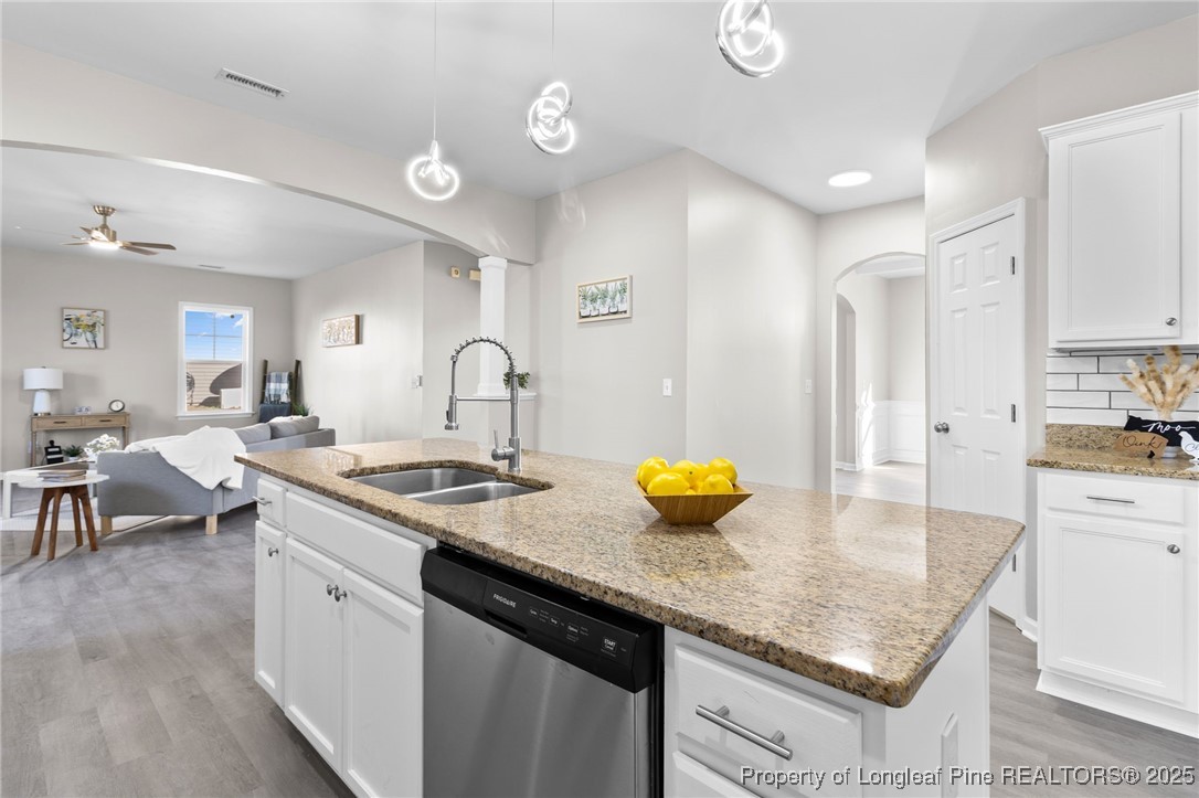 516 Heathrow Drive Spring Lake, NC 28390 - Photo 14 of 42 a kitchen with sink stove and cabinets
