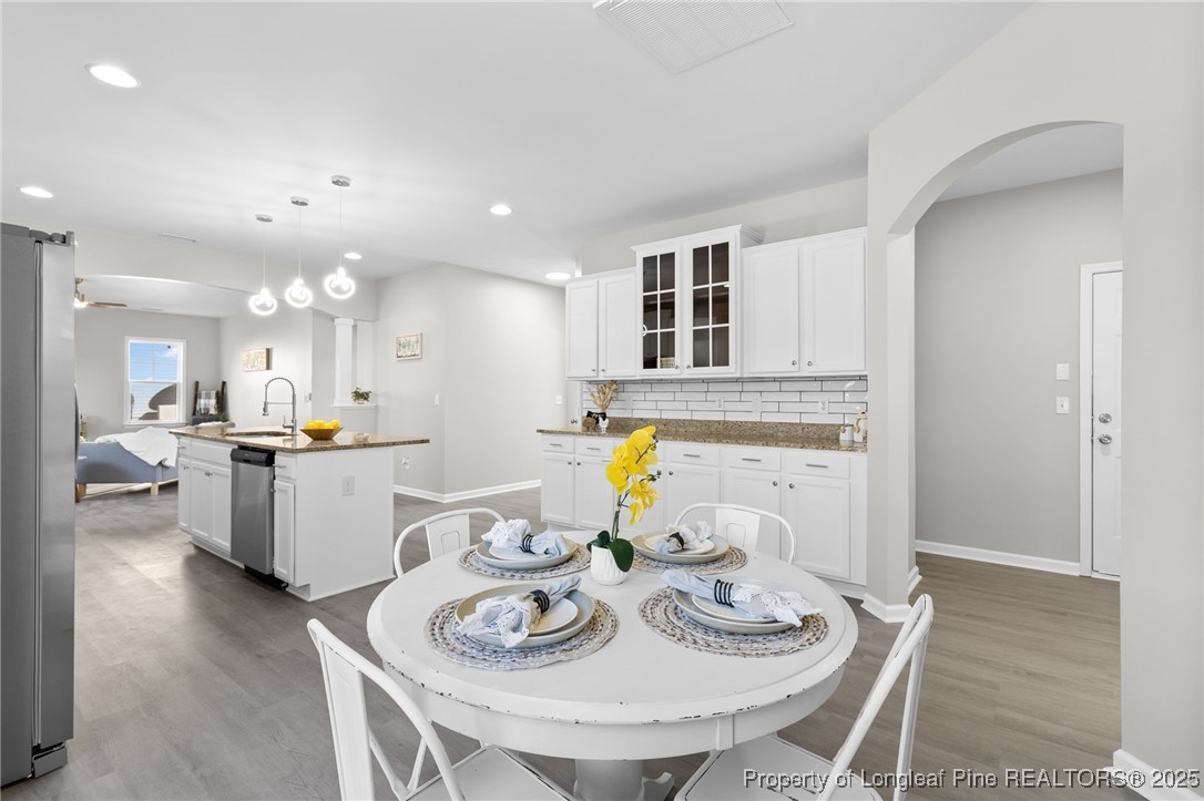 516 Heathrow Drive Spring Lake, NC 28390 - Photo 17 of 42 a open dining room with furniture and window