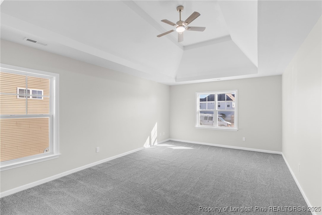 516 Heathrow Drive Spring Lake, NC 28390 - Photo 24 of 42 an empty room with a window and ceiling fan