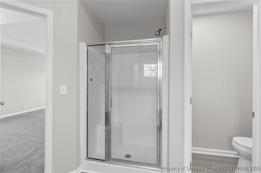 516 Heathrow Drive Spring Lake, NC 28390 - Photo 28 of 42 a bathroom with a shower and a toilet