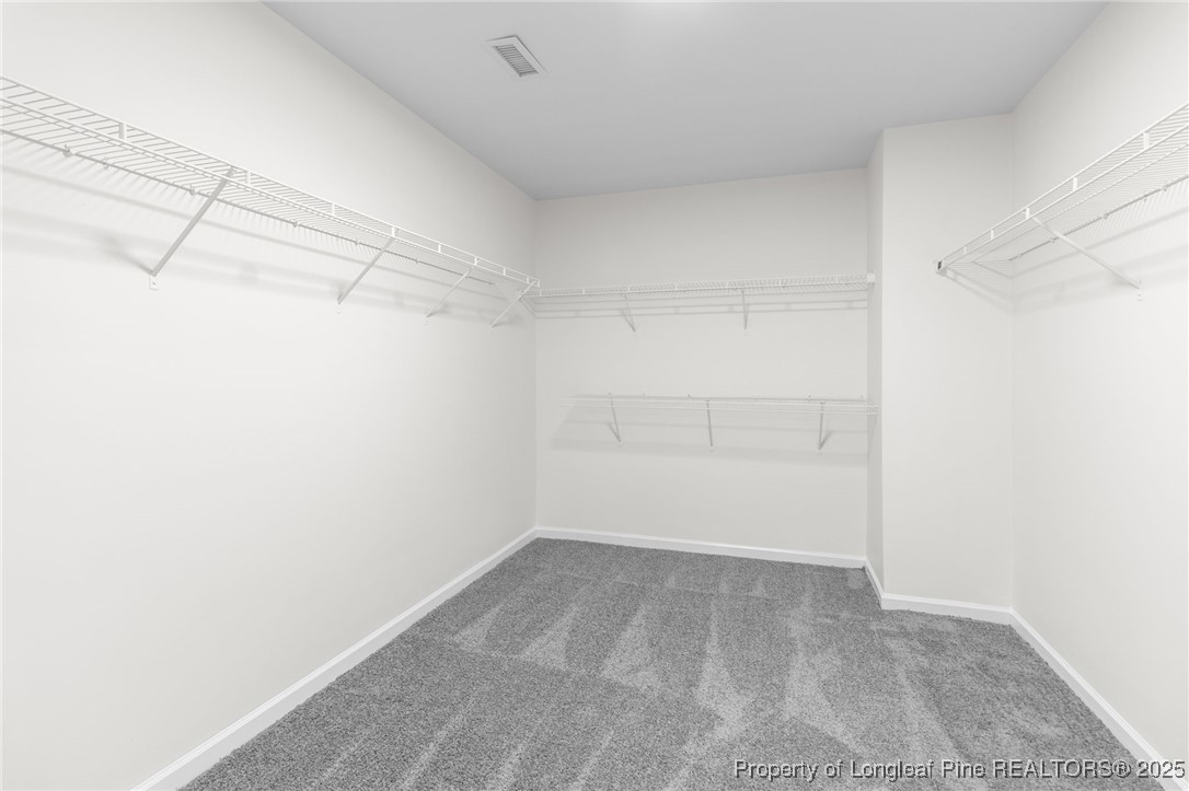 516 Heathrow Drive Spring Lake, NC 28390 - Photo 30 of 42 a view of a room with racks on the wall