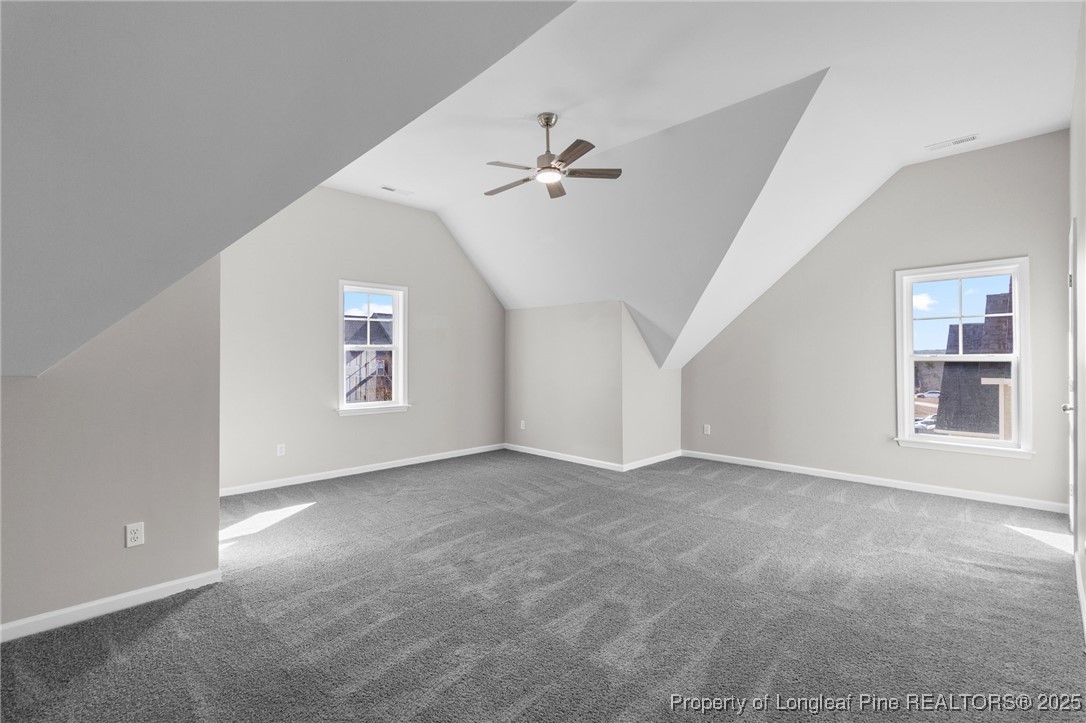 516 Heathrow Drive Spring Lake, NC 28390 - Photo 35 of 42 an empty room with windows and ceiling fan
