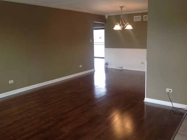 617 Quail Run Road Matteson, IL 60443 - Photo 2 of 13 an empty room with wooden floor and windows