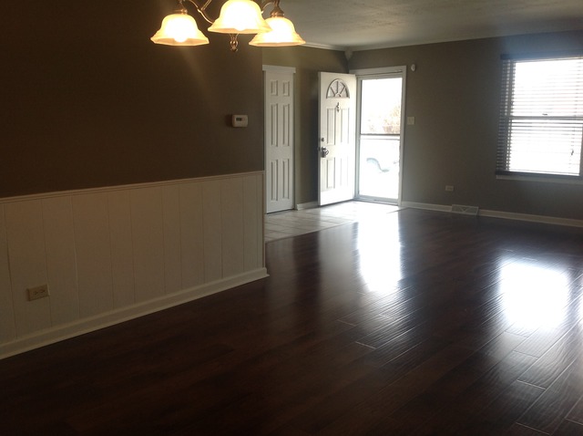 617 Quail Run Road Matteson, IL 60443 - Photo 4 of 13 a view of a livingroom with wooden floor and a window