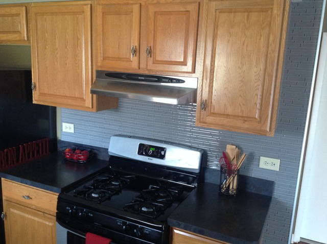 617 Quail Run Road Matteson, IL 60443 - Photo 8 of 13 a kitchen with stainless steel appliances granite countertop a stove and a microwave