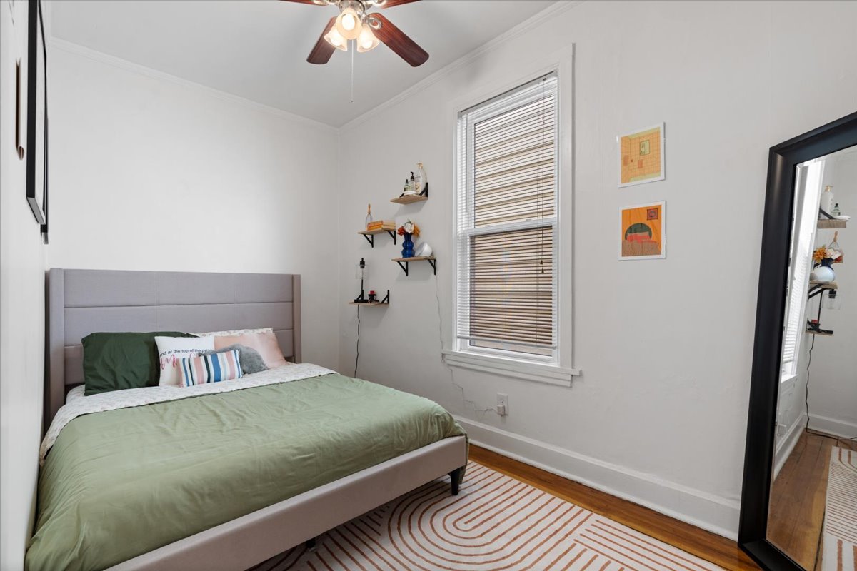 2735 North Ridgeway Avenue Chicago, IL 60647 - Photo 27 of 40 a bedroom with a bed and window