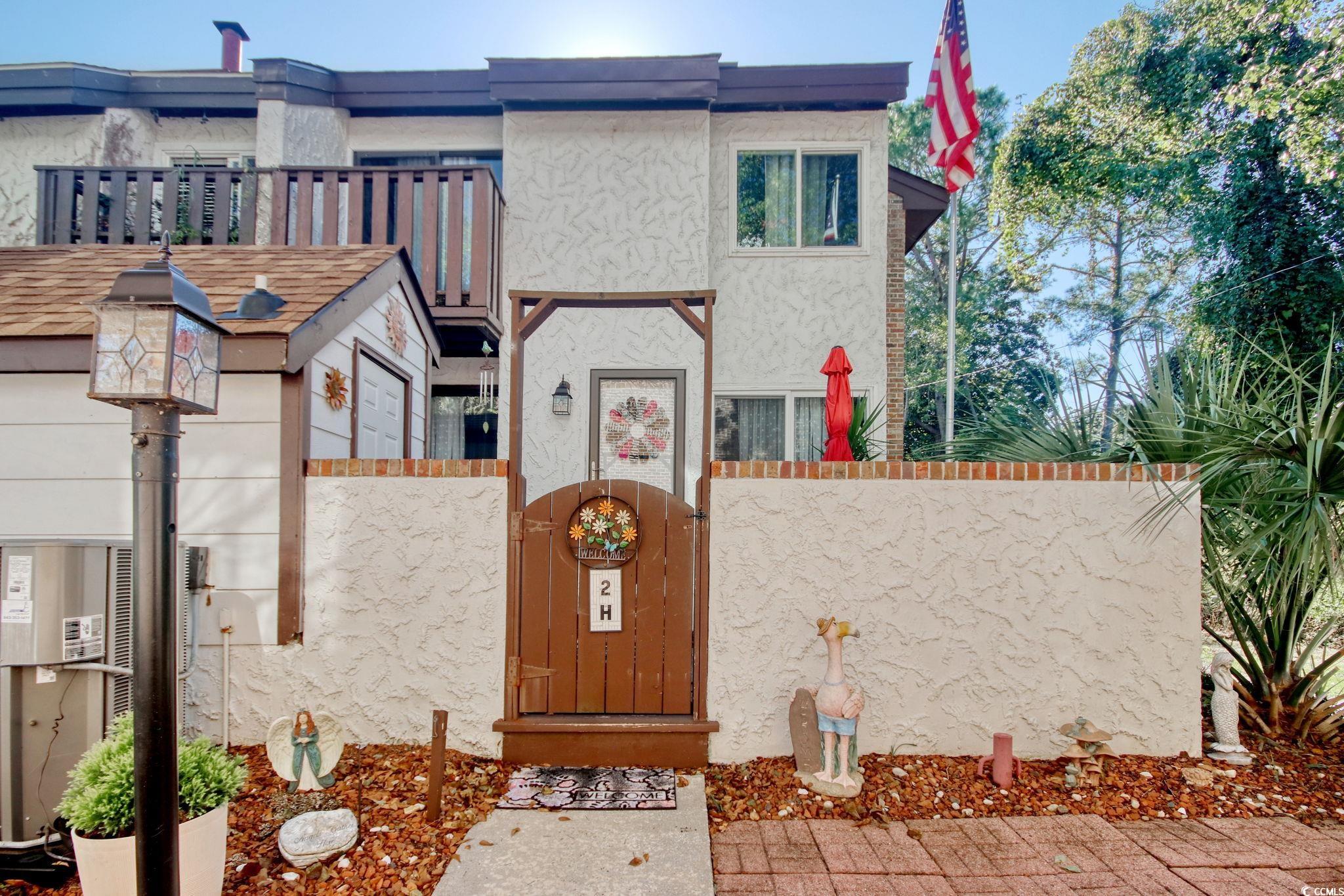 View of front of property featuring stucco siding