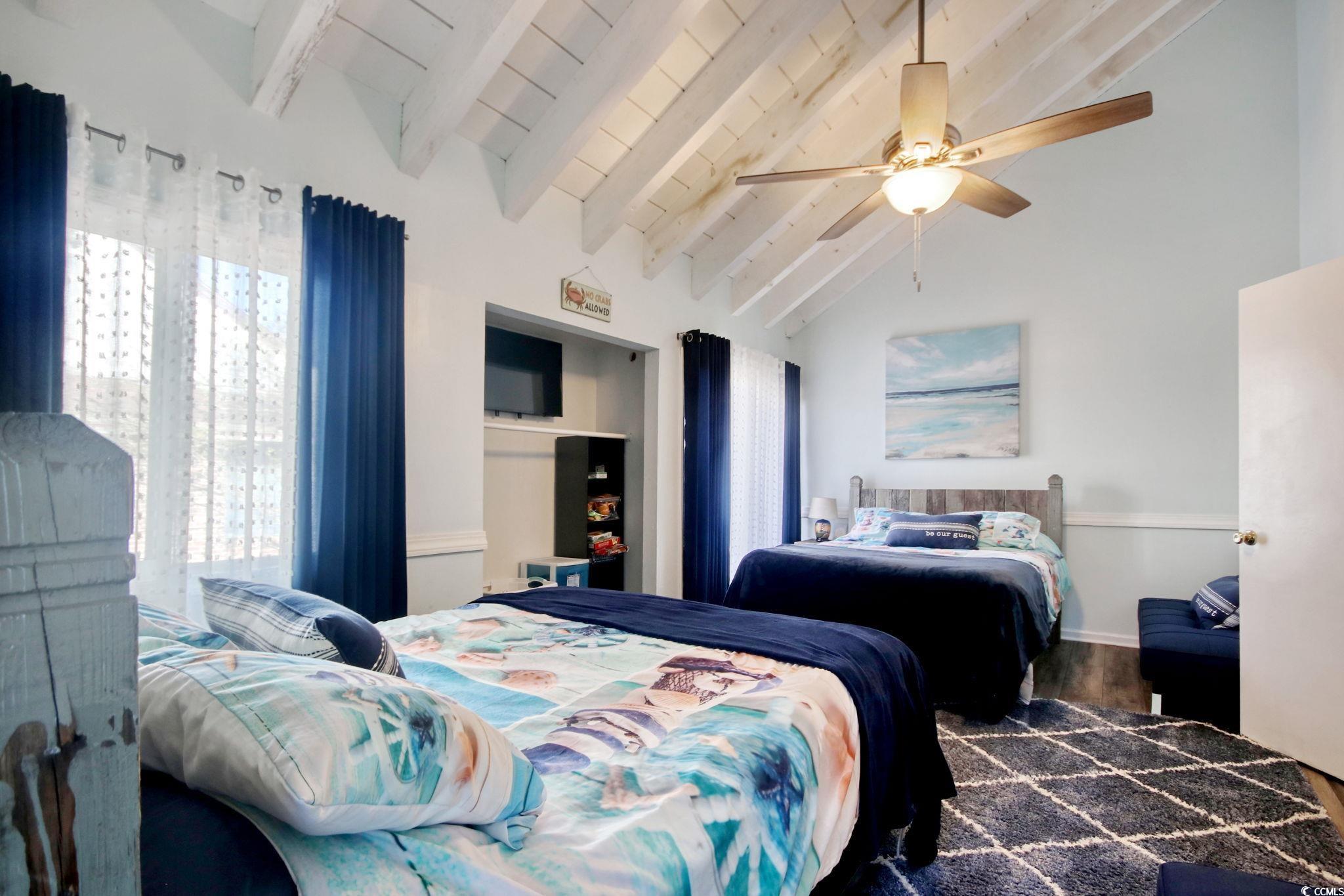 503 Pinewood Road, Unit 2H Myrtle Beach, SC 29577 - Photo 13 of 34 Bedroom with wood finished floors and ceiling fan