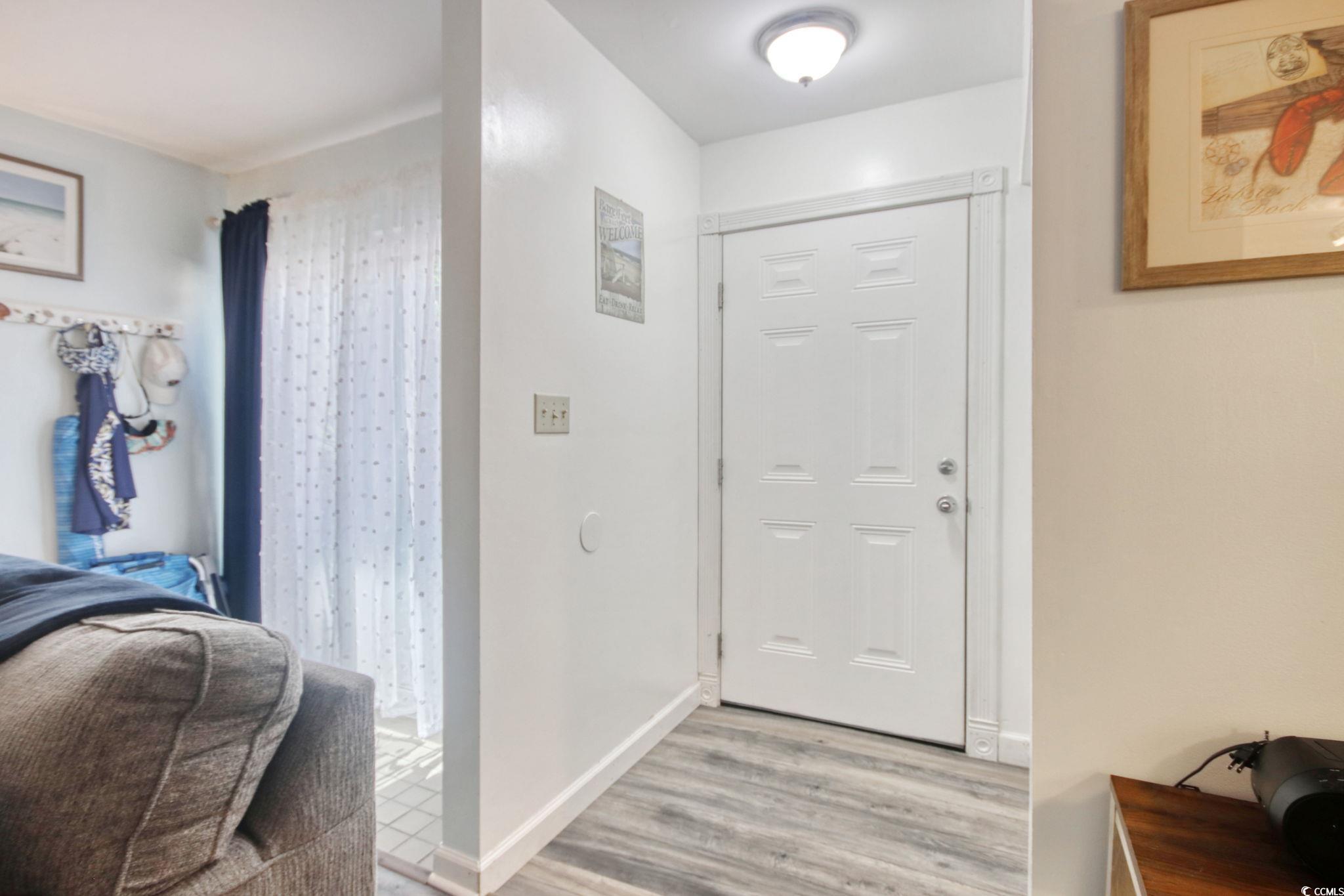 503 Pinewood Road, Unit 2H Myrtle Beach, SC 29577 - Photo 14 of 34 Entryway with light wood finished floors and baseboards