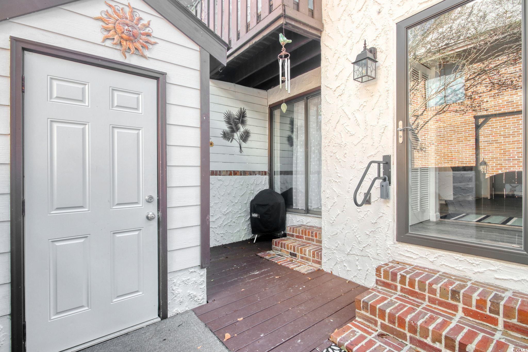 503 Pinewood Road, Unit 2H Myrtle Beach, SC 29577 - Photo 18 of 34 View of wooden terrace