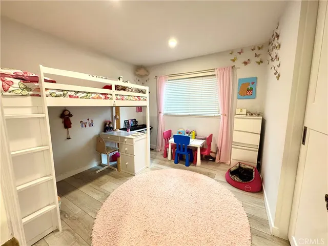 a bed room with a bed and a mirror