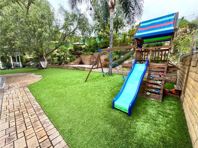 a view of a chair and table in the garden