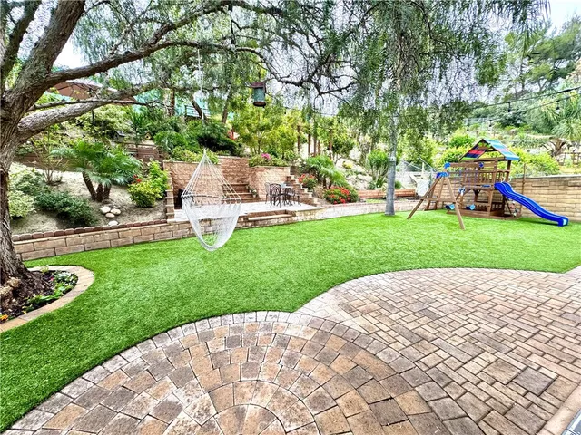 a view of lake with a garden
