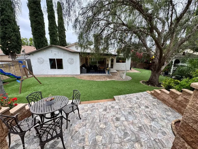 a view of a potted flower in the yard next to a road