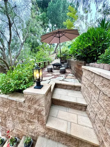 an aerial view of a house with outdoor space