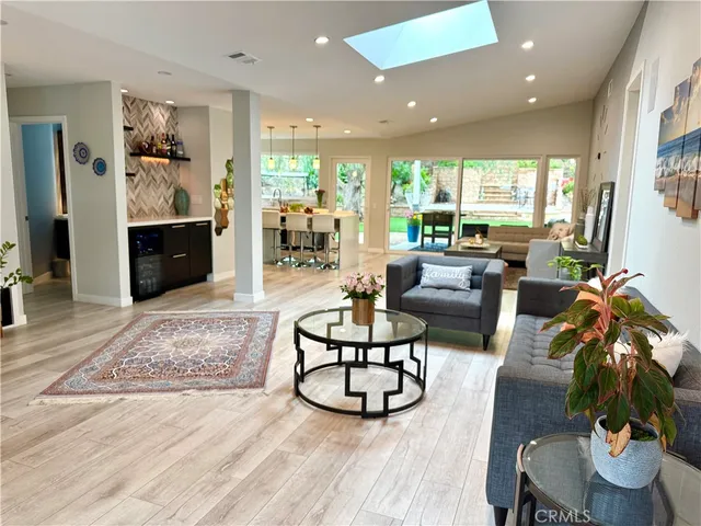 a kitchen with a table chairs stove and kitchen view