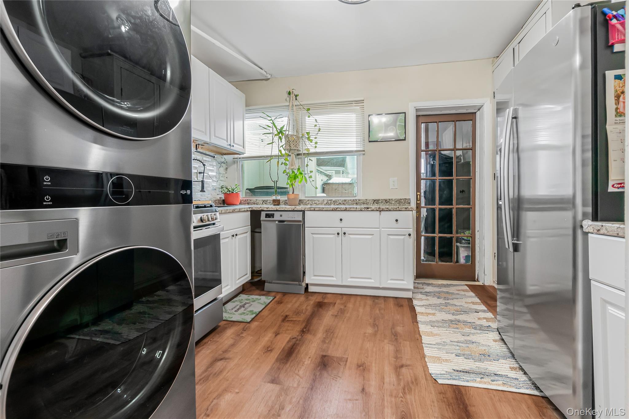 85-14 Sutter Avenue Queens, NY 11417 - Photo 12 of 27 Spacious Kitchen with and stacked washer / dryer which can be moved to the basement.