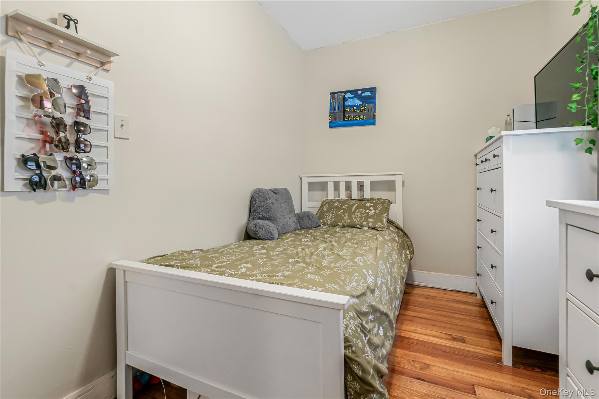 85-14 Sutter Avenue Queens, NY 11417 - Photo 22 of 27 3rd Bedroom with and light wood floors